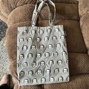 Einstein tote bag by brand “out of print.”